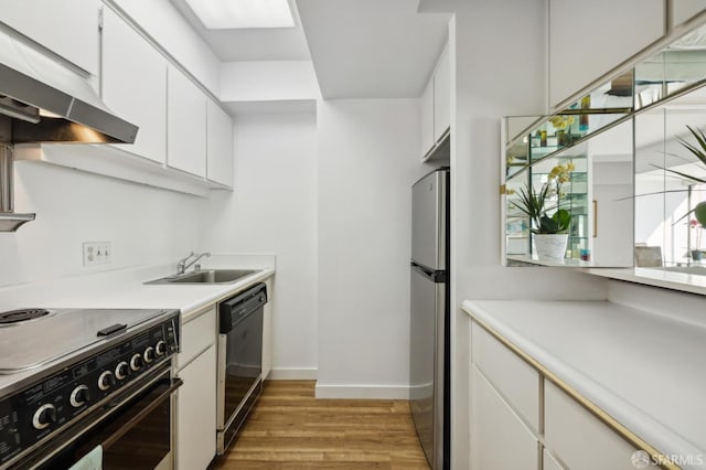 kitchen featuring sink, white cabinets, black appliances, and light hardwood / wood-style flooring