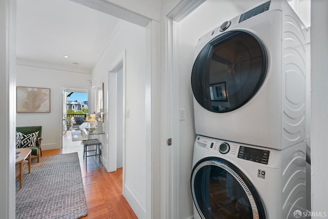 1630 Clay St Unit 4, San Francisco, CA 94109 - laundry room featuring stacked washer / dryer, light wood-type flooring, baseboards, and recessed lighting