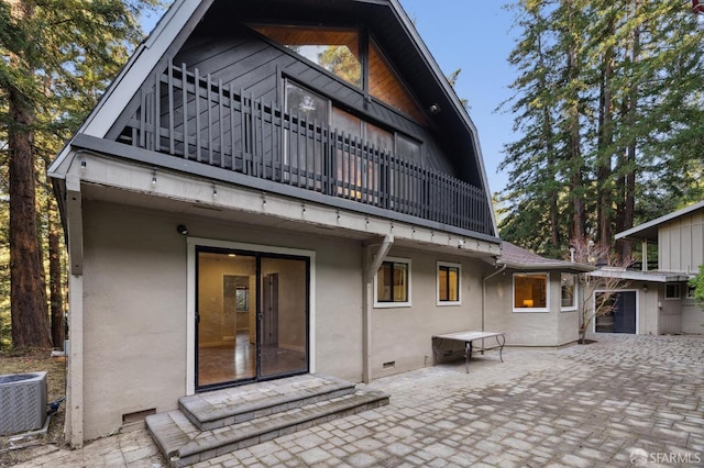 rear view of property with a patio and central air condition unit