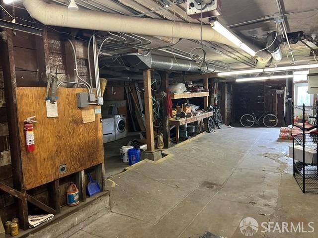 unfinished basement with washer / clothes dryer