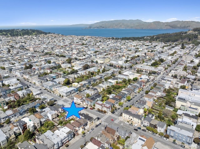 bird's eye view featuring a water and mountain view