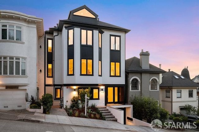 view of front of house featuring stucco siding