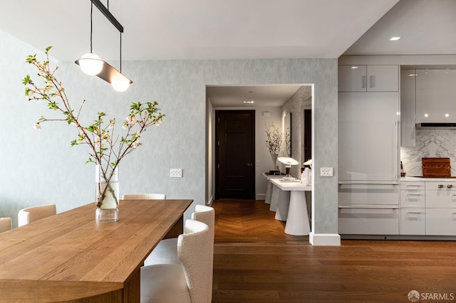 dining room with dark hardwood / wood-style floors