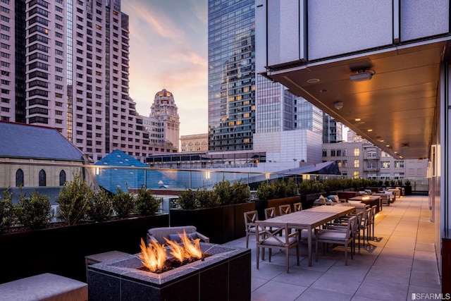 patio terrace at dusk with an outdoor fire pit