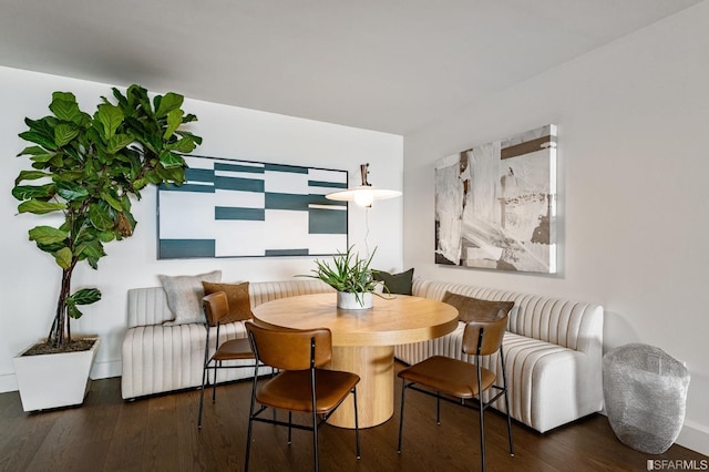 dining area featuring dark hardwood / wood-style flooring and breakfast area