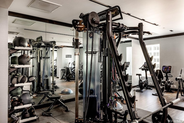 workout area featuring hardwood / wood-style floors