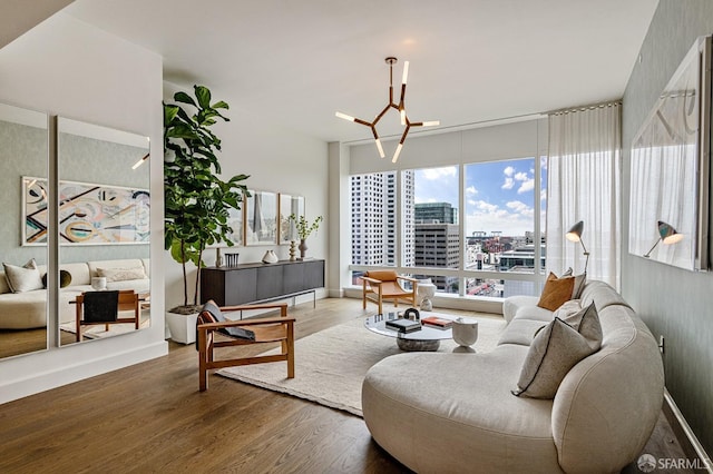 living room featuring hardwood / wood-style floors and an inviting chandelier