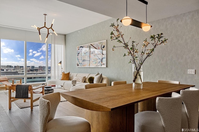 dining room featuring hardwood / wood-style flooring and a notable chandelier