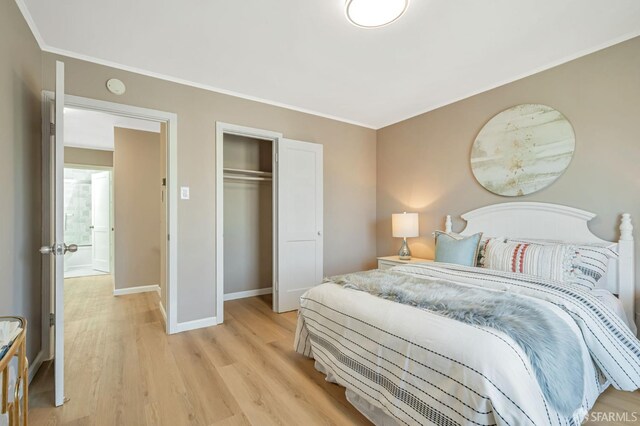 141 Cambridge St, San Francisco, CA 94134 - bedroom featuring light wood-type flooring, baseboards, crown molding, and a closet