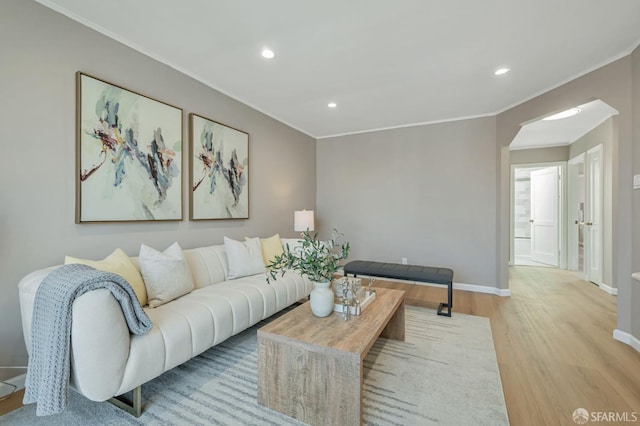 141 Cambridge St, San Francisco, CA 94134 - living room featuring wood finished floors, recessed lighting, baseboards, ornamental molding, and arched walkways