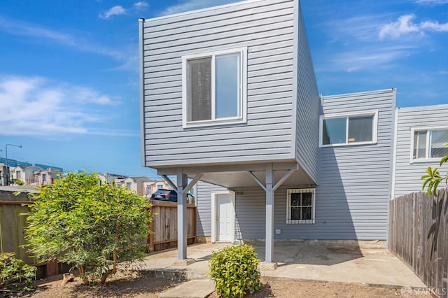 141 Cambridge St, San Francisco, CA 94134 - view of front of house with a patio area and a fenced backyard