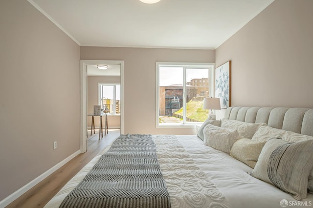 141 Cambridge St, San Francisco, CA 94134 - bedroom featuring baseboards, light wood-style floors, and ornamental molding