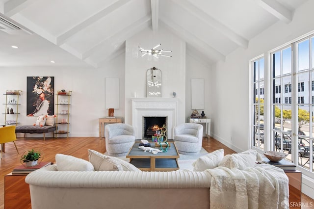 3445 Fillmore St, San Francisco, CA 94123 - living room with beamed ceiling, a lit fireplace, high vaulted ceiling, wood finished floors, and recessed lighting