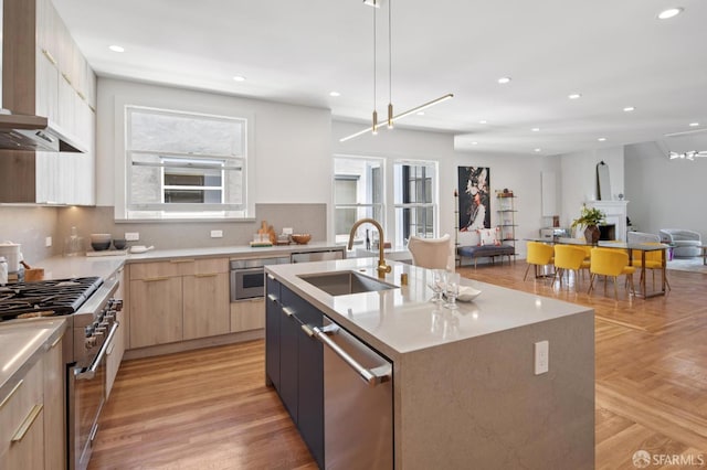 3445 Fillmore St, San Francisco, CA 94123 - kitchen featuring appliances with stainless steel finishes, premium range hood, modern cabinets, light brown cabinets, and plenty of natural light