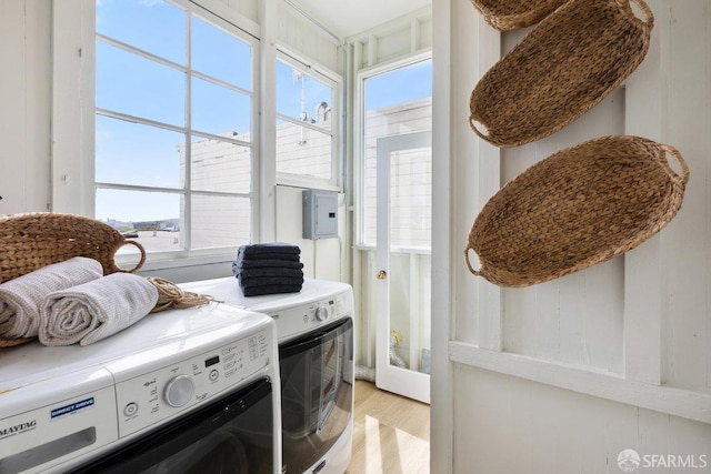 30 Lloyd St, San Francisco, CA 94117 - clothes washing area featuring washing machine and dryer and light wood-type flooring