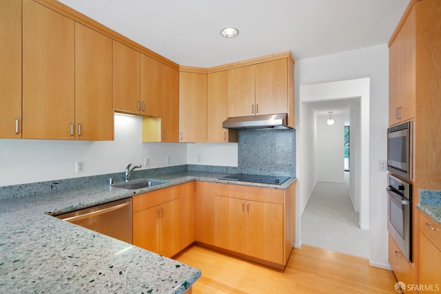 5082 Diamond Heights Blvd Unit B, San Francisco, CA 94131 - kitchen featuring appliances with stainless steel finishes, under cabinet range hood, light stone countertops, light wood-type flooring, and tasteful backsplash