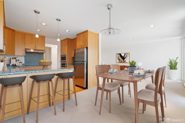 5082 Diamond Heights Blvd Unit B, San Francisco, CA 94131 - kitchen with freestanding refrigerator, under cabinet range hood, light colored carpet, a peninsula, and recessed lighting