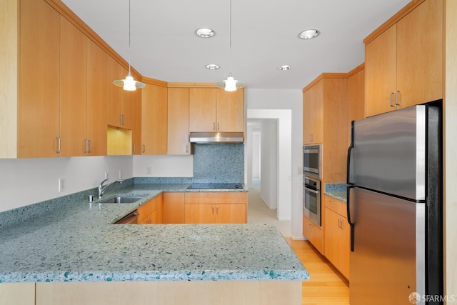 5082 Diamond Heights Blvd Unit B, San Francisco, CA 94131 - kitchen featuring appliances with stainless steel finishes, light stone counters, a peninsula, under cabinet range hood, and light wood-style flooring