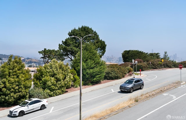 5082 Diamond Heights Blvd Unit B, San Francisco, CA 94131 - view of asphalt road featuring traffic signs, curbs, and street lights