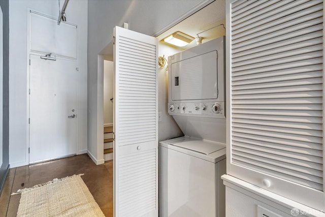 laundry room featuring stacked washer / dryer