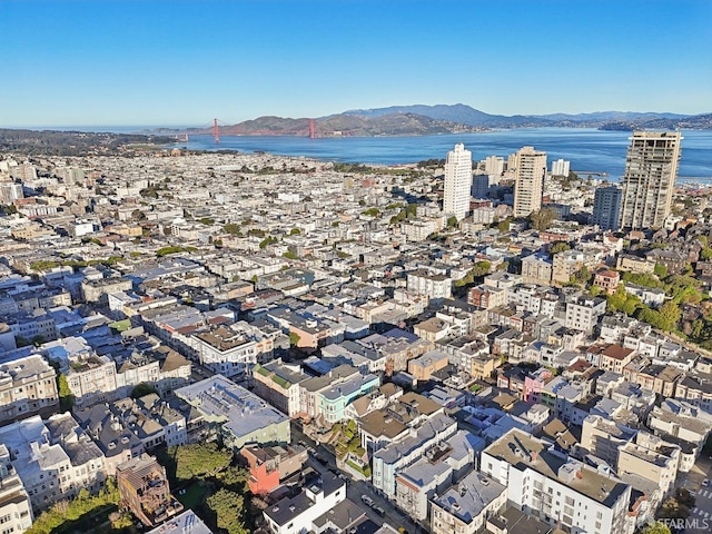 birds eye view of property featuring a view of city and a water and mountain view