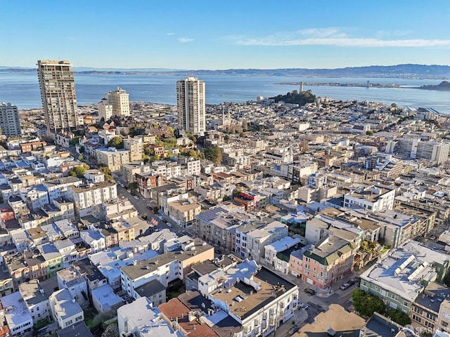 birds eye view of property featuring a view of city and a water view