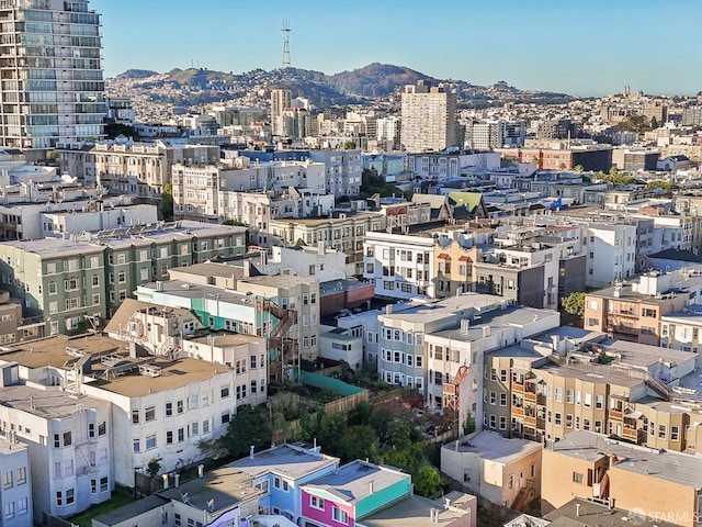 property's view of city featuring a mountain view