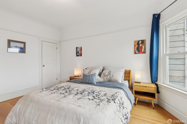 bedroom with light wood-style floors