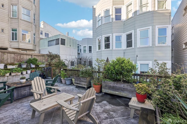 view of patio / terrace featuring fence