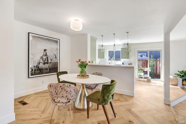 dining room with visible vents and baseboards