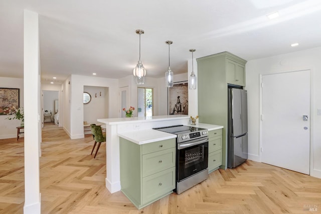 kitchen with a peninsula, appliances with stainless steel finishes, green cabinets, and light countertops