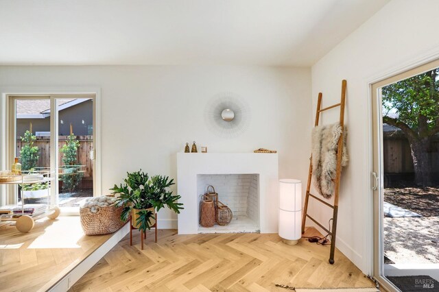 living area featuring baseboards