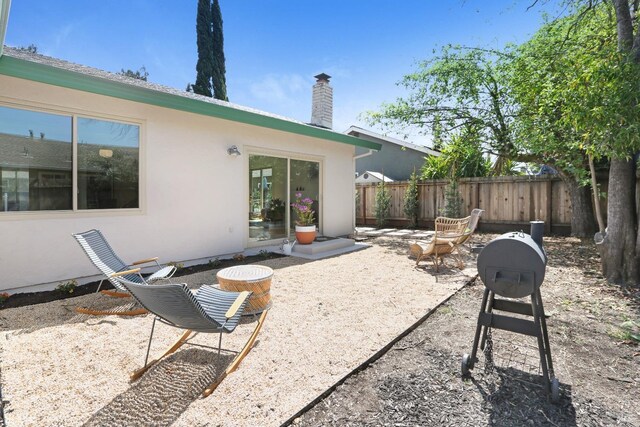 view of patio featuring fence