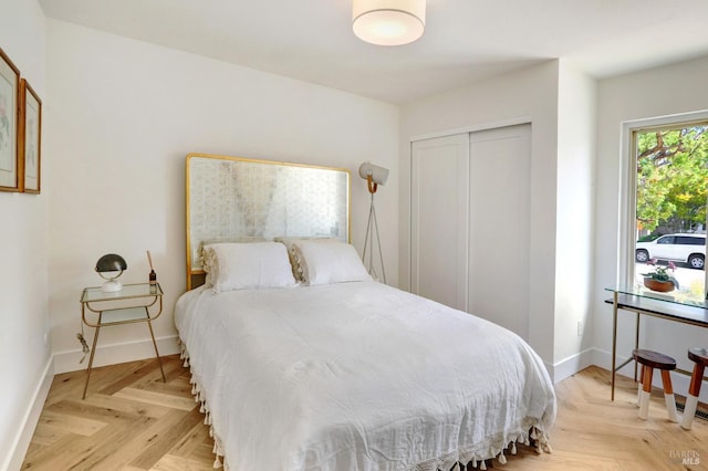 bedroom featuring a closet and baseboards