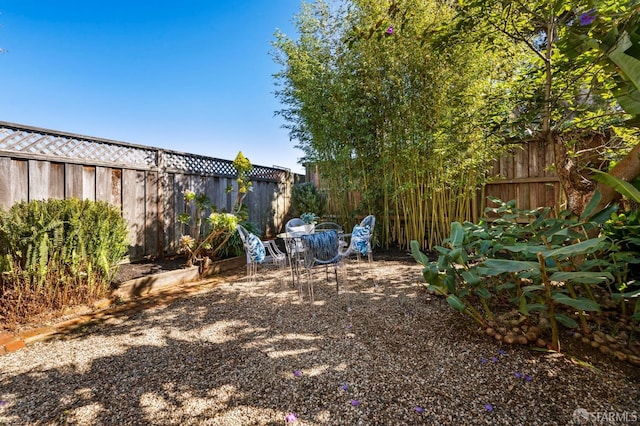 view of yard with a fenced backyard