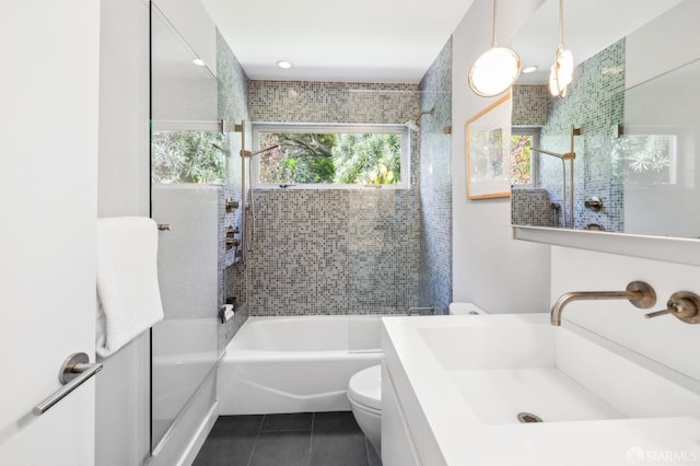 bathroom with vanity, shower / bathing tub combination, tile patterned flooring, and toilet