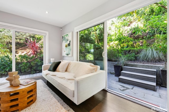 living room with recessed lighting and wood finished floors