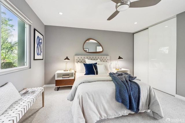 bedroom with baseboards, ceiling fan, carpet, a closet, and recessed lighting