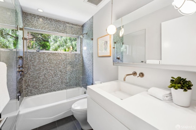 full bathroom featuring visible vents, toilet,  shower combination, tile patterned flooring, and vanity