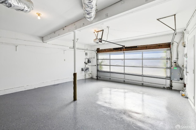 garage with electric panel and a garage door opener