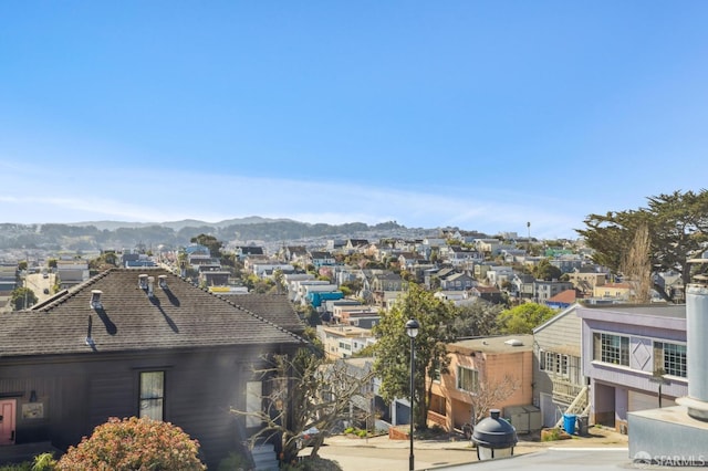 view of city with a residential view and a mountain view