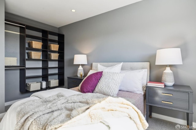 bedroom with carpet floors, baseboards, and recessed lighting