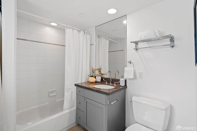 full bathroom with vanity, toilet, and shower / bath combo