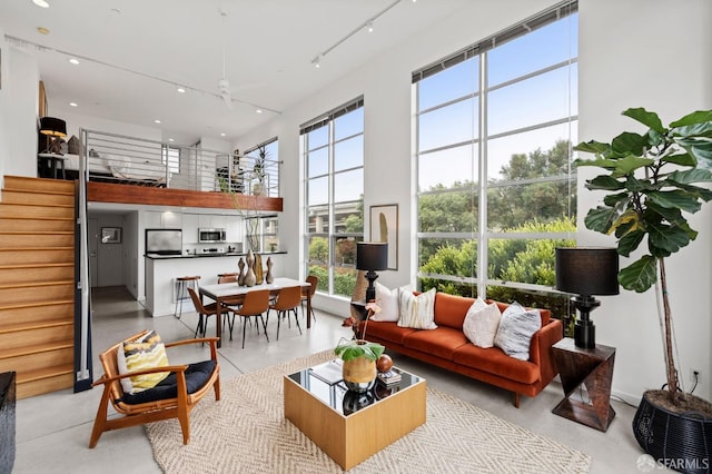 interior space featuring a high ceiling and track lighting