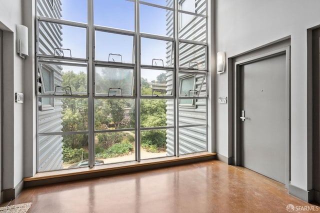 doorway to outside with concrete floors