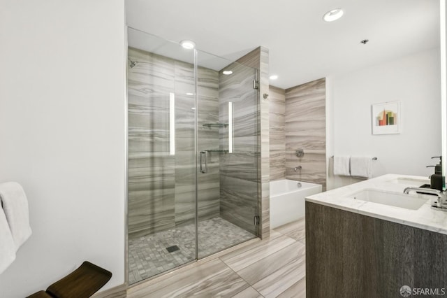 338 Main St Unit 6E, San Francisco, CA 94105 - full bath featuring a stall shower, a garden tub, recessed lighting, and double vanity