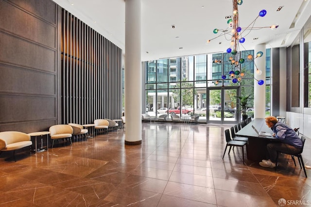 338 Main St Unit 6E, San Francisco, CA 94105 - common area featuring a wall of windows and a towering ceiling