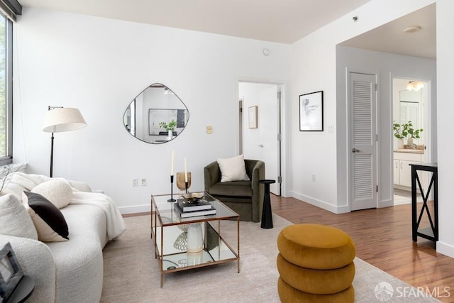 living room with wood finished floors and baseboards