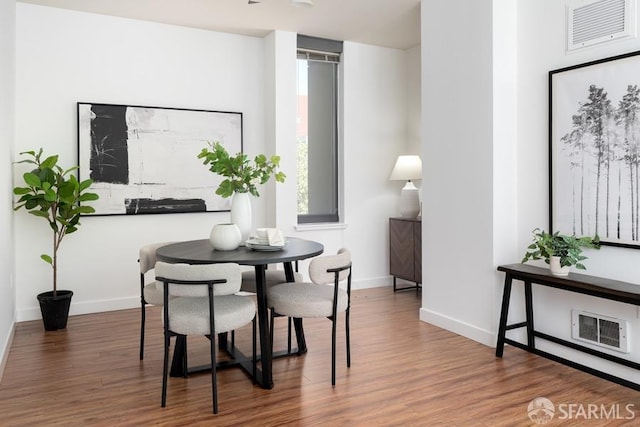 dining room with wood finished floors and baseboards