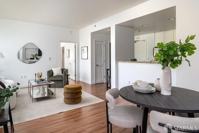living room with wood finished floors and baseboards